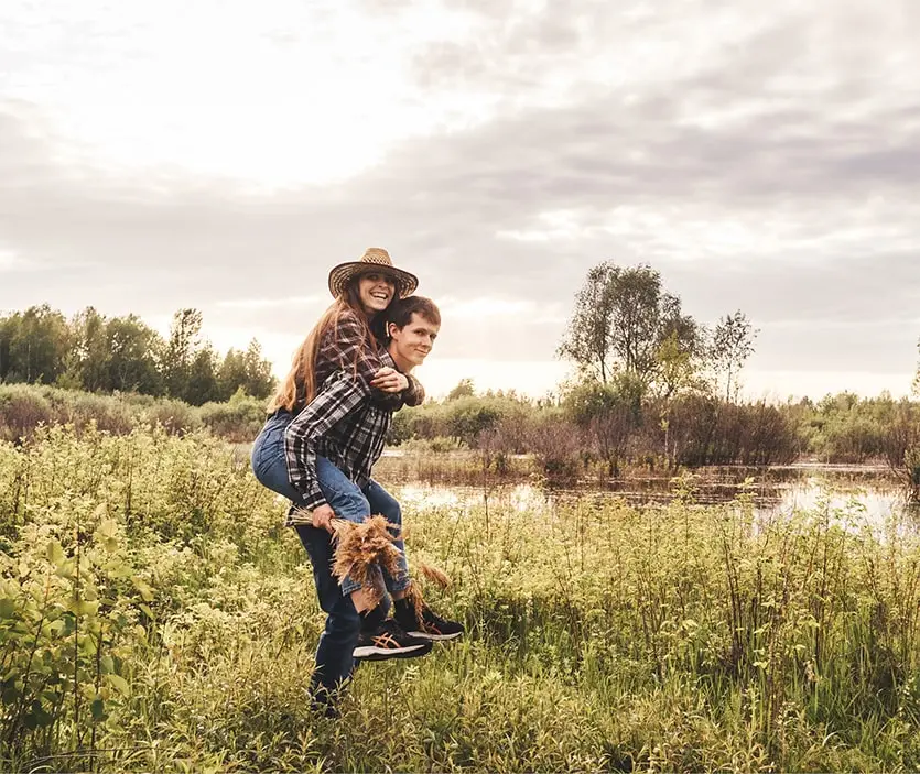 A couple enjoying hiking near the lake